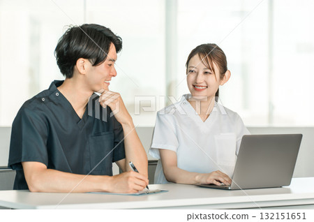 Medical workers in scrubs, medical staff, male doctors and female nurses in white coats Medical workers in scrubs, medical staff, male doctors and female nurses in white coats 132151651