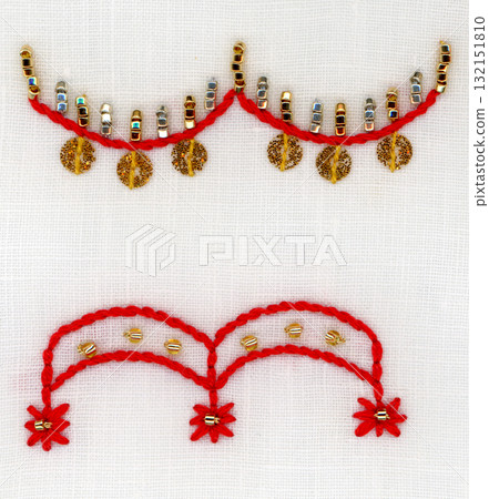 Decorated with gold and silver beads and red embroidery thread Decorated with gold and silver beads and red embroidery thread 132151810