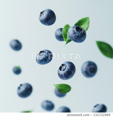Fresh blueberries with green leaves floating in the air. Concept of healthy eating and nutrition. 132152069
