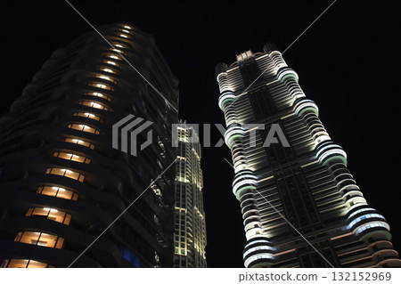 Illuminated apartment buildings in Pyongyang at night Illuminated apartment buildings in Pyongyang at night 132152969