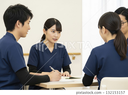 Caregivers sharing information at a team meeting Caregivers sharing information at a team meeting 132153157