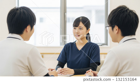 Caregivers sharing information at a team meeting 132153164