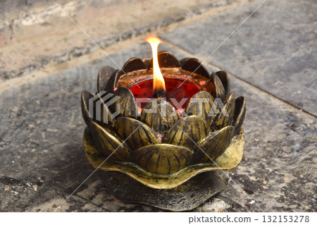 The flickering flame of a candle at the Shaolin Temple The flickering flame of a candle at the Shaolin Temple 132153278