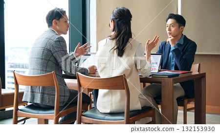 Group of casual business people meeting in an office Group of casual business people meeting in an office 132153930