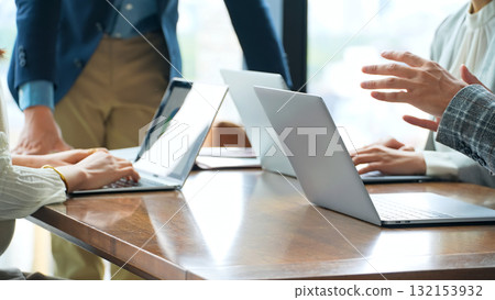 Group of casual business people meeting in an office Group of casual business people meeting in an office 132153932