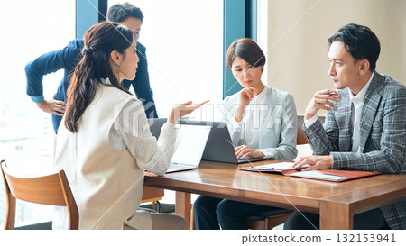 Group of casual business people meeting in an office 132153941