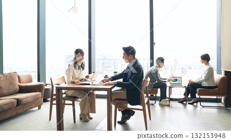 A group of casual business people meeting in a lobby 132153948