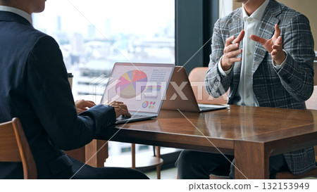 A group of casual business people meeting in a lobby A group of casual business people meeting in a lobby 132153949
