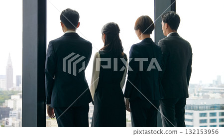 Group of business people looking out from their office 132153956