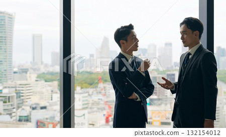 Group of business people having a conversation in the lobby 132154012