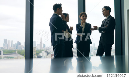 Group of business people having a conversation in the office 132154017