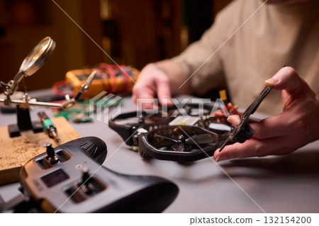 Conducting Detailed and Precise Repair Work Using Various Tools and Electronic Components Conducting Detailed and Precise Repair Work Using Various Tools and Electronic Components 132154200