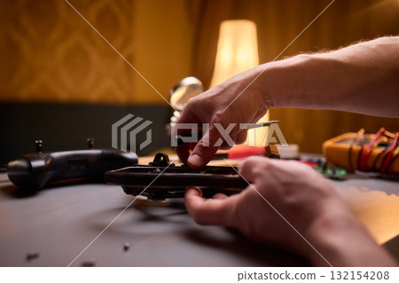 User Engaging in the Repair and Restoration of a Device Comprehensive Electronics Work 132154208