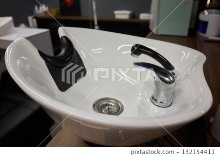 This modern salon sink features a stylish faucet design that adds a touch of elegance 132154411