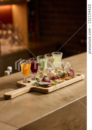 Enjoy artisan crafted cocktails paired with a delightful charcuterie board experience Enjoy artisan crafted cocktails paired with a delightful charcuterie board experience 132154428