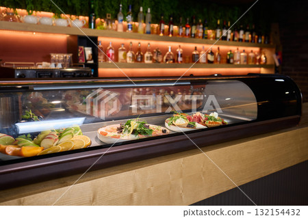 A Variety of Delicious Dishes Are Beautifully Displayed in the Restaurants Bar Area 132154432