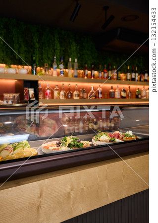 A Variety of Delicious Dishes Are Beautifully Displayed in the Restaurants Bar Area 132154433