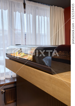 A Variety of Delicious Dishes Are Beautifully Displayed in the Restaurants Bar Area 132154435