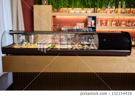 A Variety of Delicious Dishes Are Beautifully Displayed in the Restaurants Bar Area 132154438