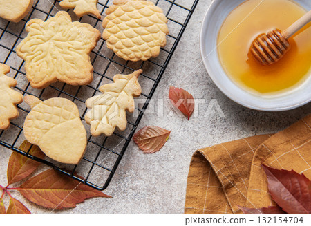 Autumn cookies baking with honey and fall leaves 132154704