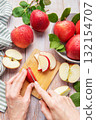 Cutting fresh red apples preparing healthy food 132154707