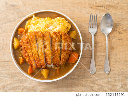 curry rice with fried pork cutlet and creamy omelet curry rice with fried pork cutlet and creamy omelet 132155291