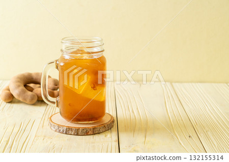 Delicious sweet drink tamarind juice and ice cube Delicious sweet drink tamarind juice and ice cube 132155314