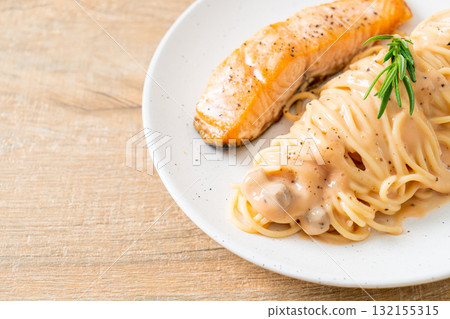 grilled salmon with spaghetti creamy tomato sauce grilled salmon with spaghetti creamy tomato sauce 132155315