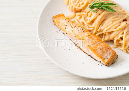 grilled salmon with spaghetti creamy tomato sauce grilled salmon with spaghetti creamy tomato sauce 132155316