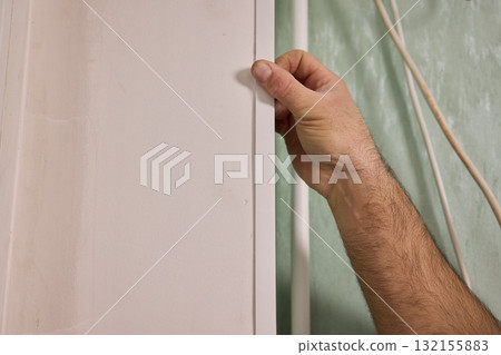 Applying Caulk to Wall Trim in Order to Achieve a Neat and Clean Finish for Your Home Applying Caulk to Wall Trim in Order to Achieve a Neat and Clean Finish for Your Home 132155883