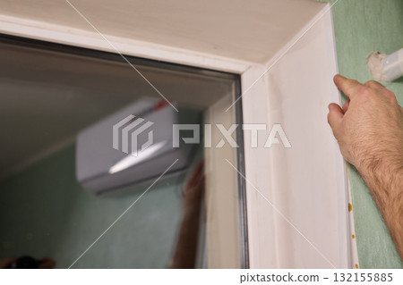 Applying Caulk to Wall Trim in Order to Achieve a Neat and Clean Finish for Your Home Applying Caulk to Wall Trim in Order to Achieve a Neat and Clean Finish for Your Home 132155885