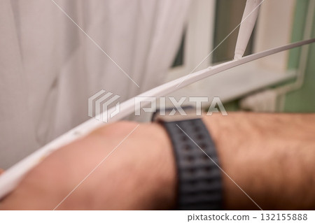 Hand Applying Adhesive with a Caulking Gun for Various Home Interior and Exterior Projects 132155888