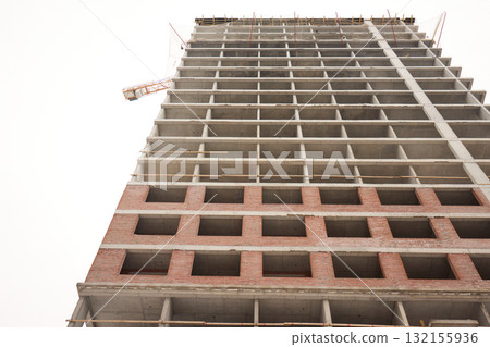 A bustling Construction Site showcasing Cranes, Building Framework, and full activity all around A bustling Construction Site showcasing Cranes, Building Framework, and full activity all around 132155936