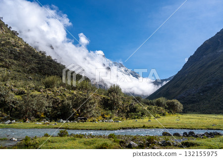 River and snow-capped mountains along the Laguna 69 trek in Huaraz, Peru 132155975