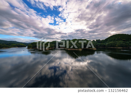 White clouds floating in the blue sky and the lake surface reflecting the beautiful sky at Nara Nunome Dam 4 White clouds floating in the blue sky and the lake surface reflecting the beautiful sky at Nara Nunome Dam 4 132156462