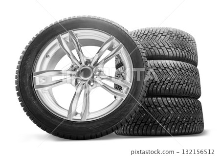 Studded winter wheels set - cast aluminum wheels mounted on low-profile beautiful studded tires, stack of 4 pieces, isolate on a white background. Sale and replacement of wheels 132156512