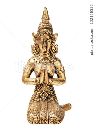 This miniature silver statue depicts a goddess with intricate details, captured in a prayer pose. It highlights the artistry of ancient Asian craftsmanship against a clean backdrop. 132156536