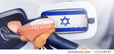 The Israel flag on the lid of the gas tank of a car at a gas station in close-up. High or low gasoline prices at Israeli gas stations. Gasoline prices are rising due to a shortage of diesel fuel The Israel flag on the lid of the gas tank of a car at a gas station in close-up. High or low gasoline prices at Israeli gas stations. Gasoline prices are rising due to a shortage of diesel fuel 132156597