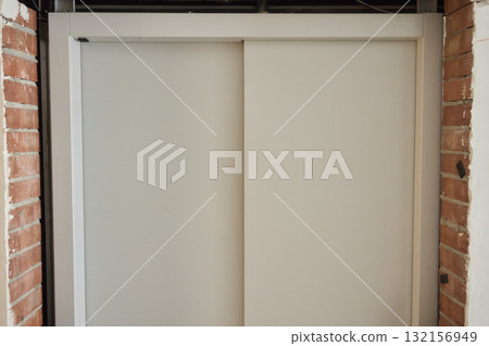 Contemporary interior column design featuring a sophisticated blend of gray and brick elements Contemporary interior column design featuring a sophisticated blend of gray and brick elements 132156949