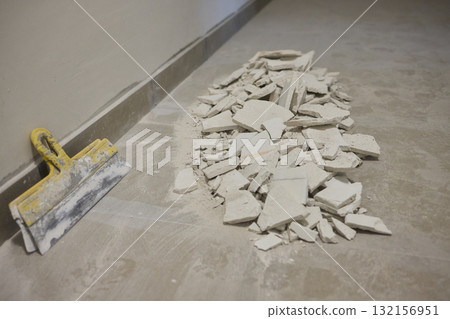 Construction debris is scattered across the floor after the recent renovation work Construction debris is scattered across the floor after the recent renovation work 132156951