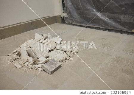 Construction debris is scattered across the floor after the recent renovation work Construction debris is scattered across the floor after the recent renovation work 132156954