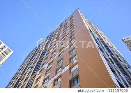 A bustling Construction Site showcasing Cranes, Building Framework, and full activity all around 132157003