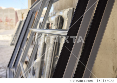 Stacked window frames are now fully prepared and ready for the upcoming installation process 132157028
