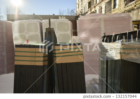 The installation of construction glass panels is taking place at the building site The installation of construction glass panels is taking place at the building site 132157044