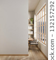 Empty white wall along a wooden floor corridor or hallway with an entrance to study room or library. 132157292