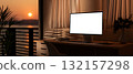 White screen computer on table with books and armchair in sunset light. Study or Working at evening. 132157298