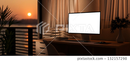 White screen computer on table with books and armchair in sunset light. Study or Working at evening. White screen computer on table with books and armchair in sunset light. Study or Working at evening. 132157298