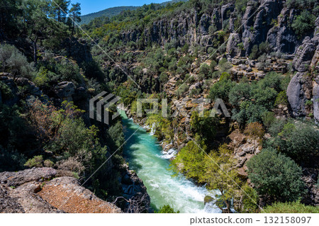 Crystal-clear water in a wild rocky gorge 132158097