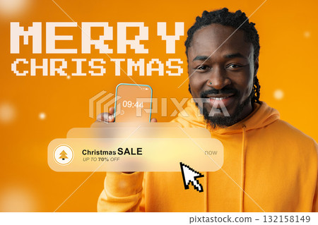 Festive man holding phone with Christmas sale announcement on bright orange background Festive man holding phone with Christmas sale announcement on bright orange background 132158149