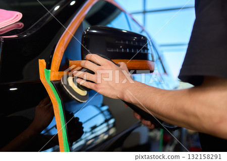 A Detailed Close Up of the Car Polishing Process in the Field of Automotive Detailing 132158291